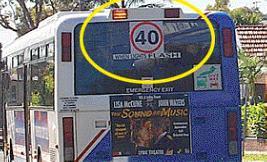 General Knowledge - When you see these lights flashing on the back of a bus, what should you do?