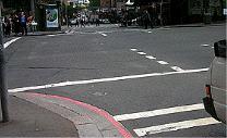 Intersections - You wish to turn left here. The pedestrian lights are flashing red. You should: