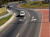 Intersections - You wish to go straight ahead on this roundabout with two lanes. Which lane may you use?