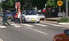 Pedestrians - You approach a crossing and see the scene in the picture. You should: