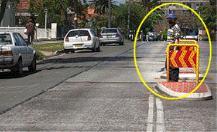 Pedestrians - This person is standing on a pedestrian refuge. If he steps out onto your lane you should: